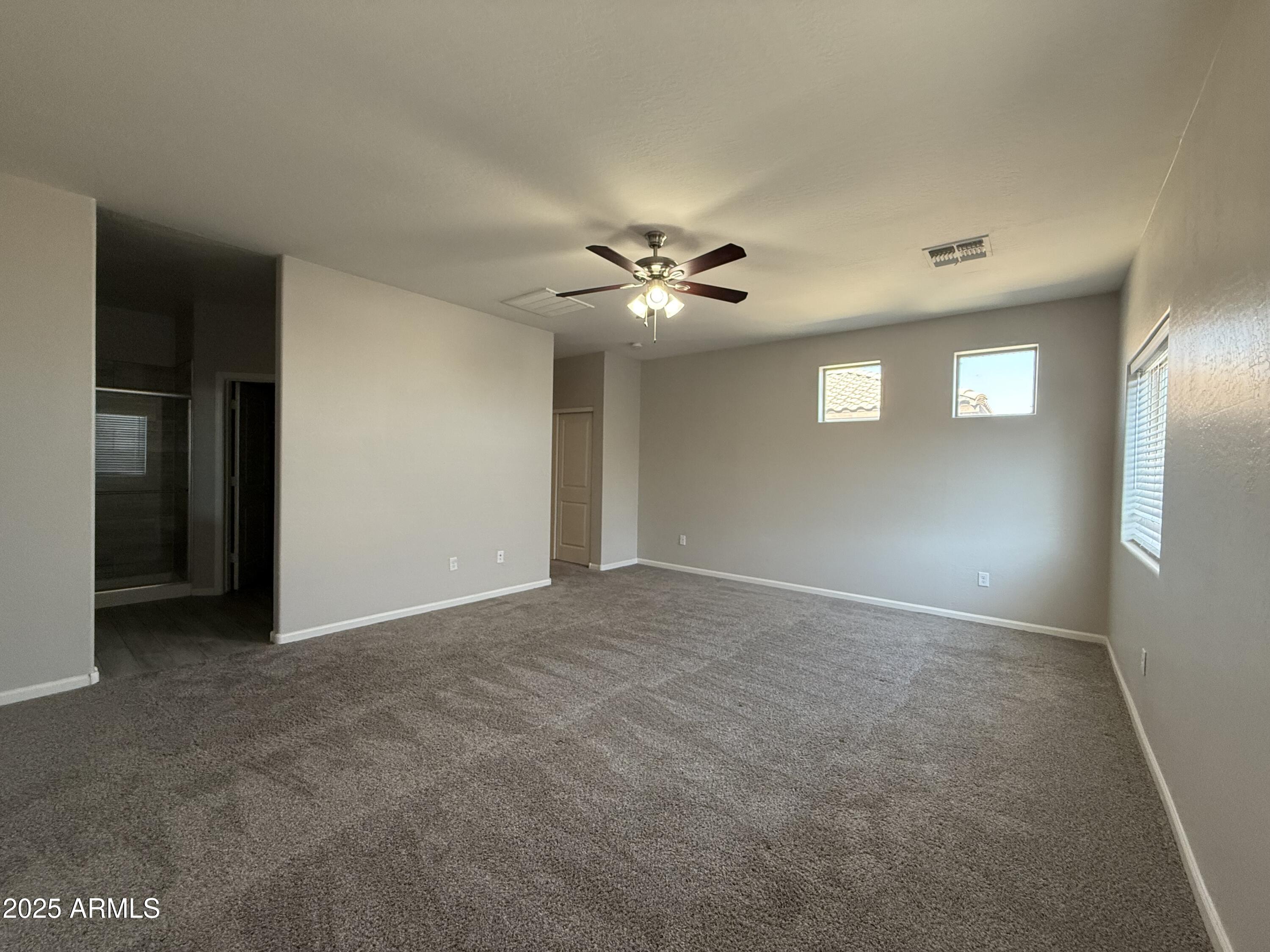 1743 West Pollack Street Phoenix, AZ 85041 - Photo 40 of 46 a view of an empty room with a ceiling fan