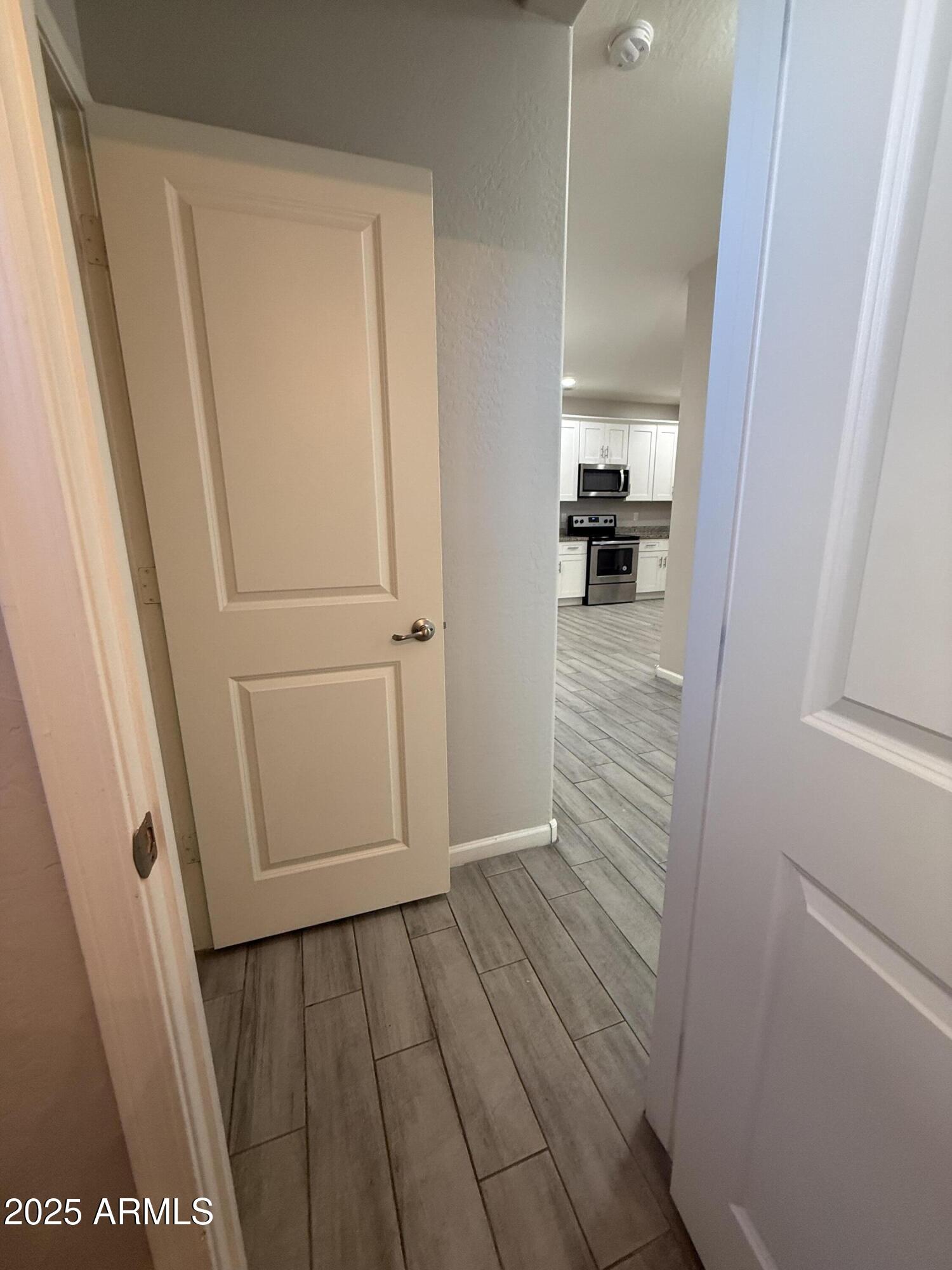 1743 West Pollack Street Phoenix, AZ 85041 - Photo 7 of 46 a view of a hallway view of wooden floor and staircase