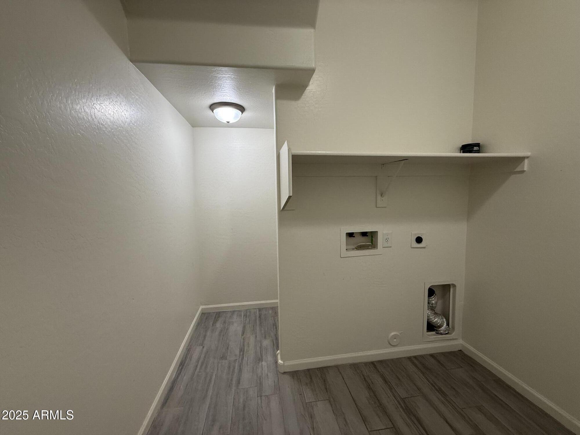 1743 West Pollack Street Phoenix, AZ 85041 - Photo 9 of 46 a view of small space with wooden floor