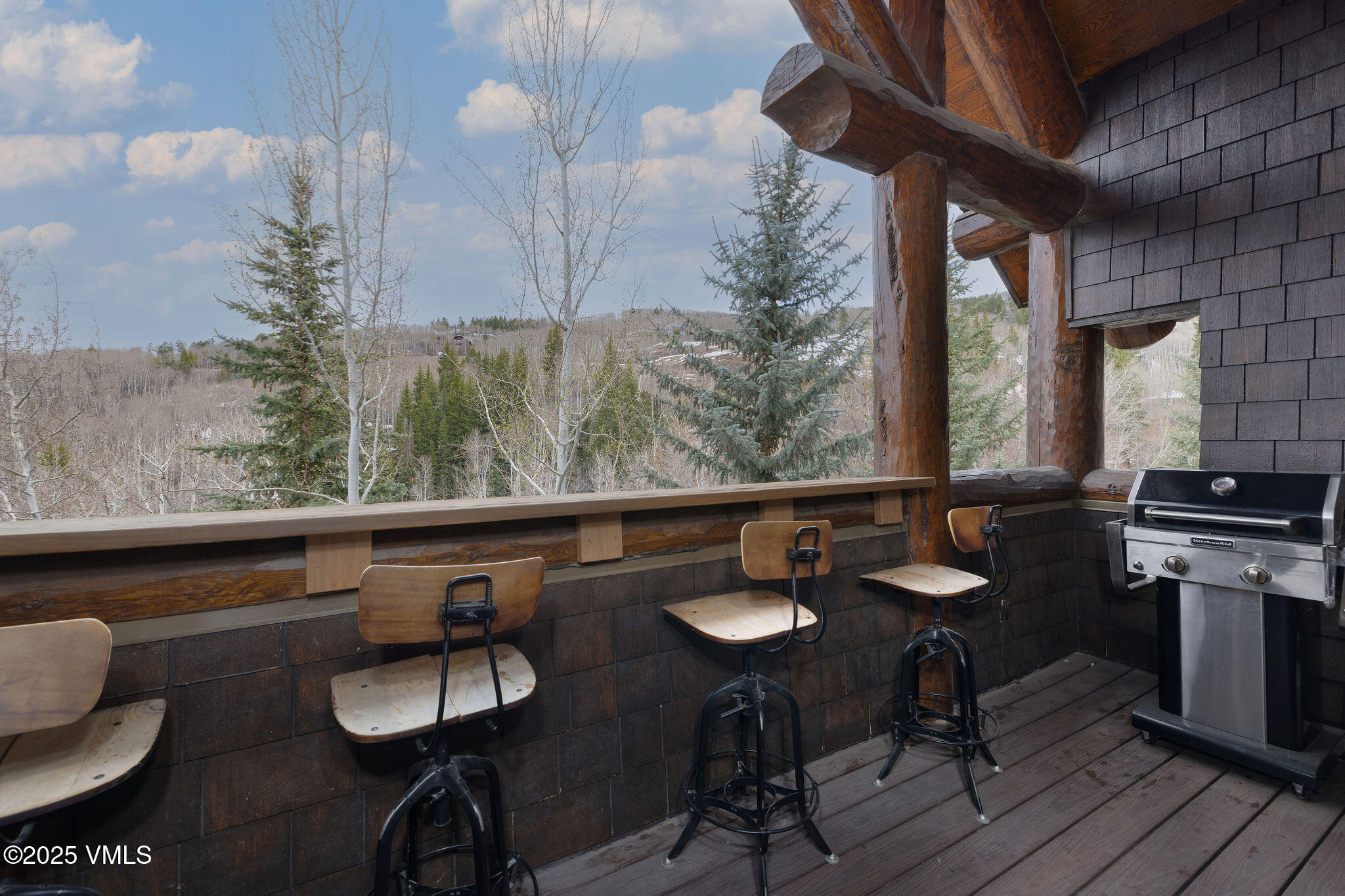 180 Daybreak Ridge Road, Unit 711 Beaver Creek, CO 81620 - Photo 12 of 17 a view of a dining room with furniture window and wooden floor