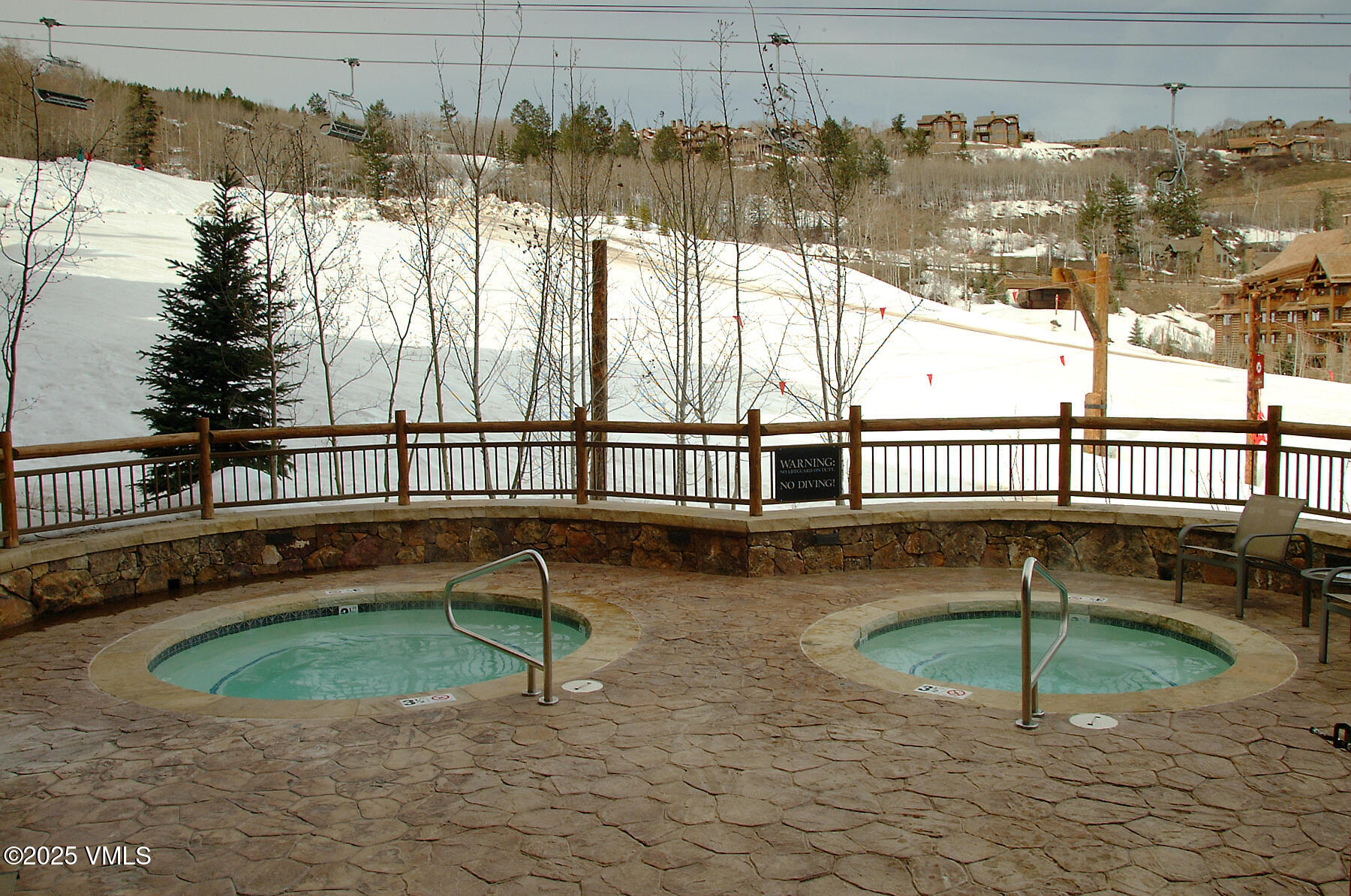 180 Daybreak Ridge Road, Unit 711 Beaver Creek, CO 81620 - Photo 16 of 17 a view of a swimming pool with a patio