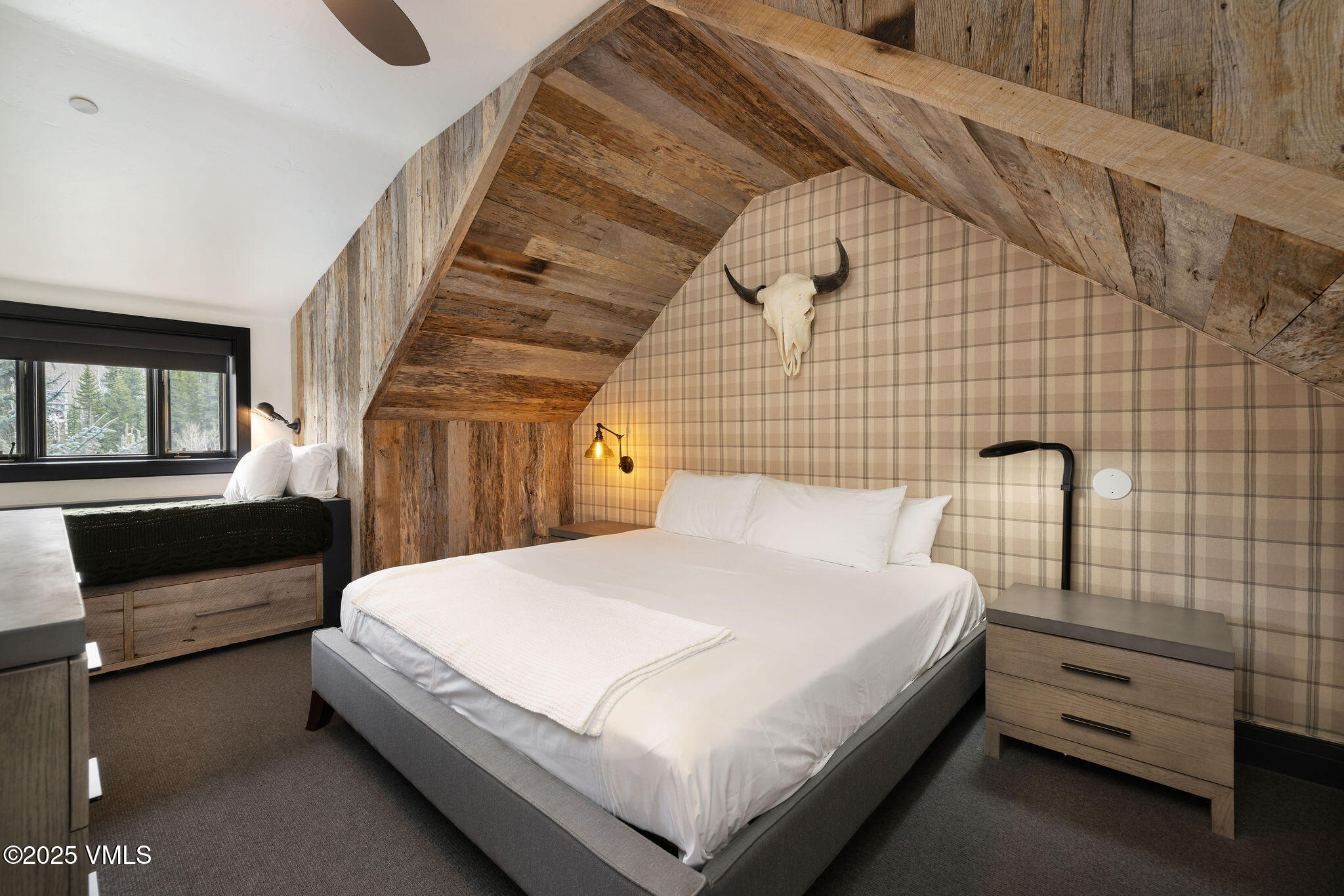 180 Daybreak Ridge Road, Unit 711 Beaver Creek, CO 81620 - Photo 5 of 17 a bedroom with a bed and a night stand