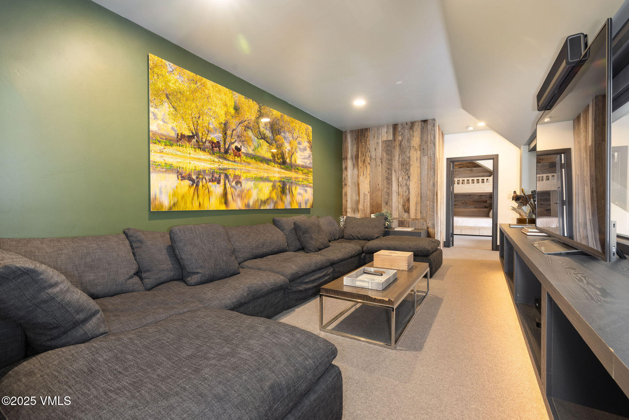 180 Daybreak Ridge Road, Unit 711 Beaver Creek, CO 81620 - Photo 8 of 17 a living room with furniture and a large window