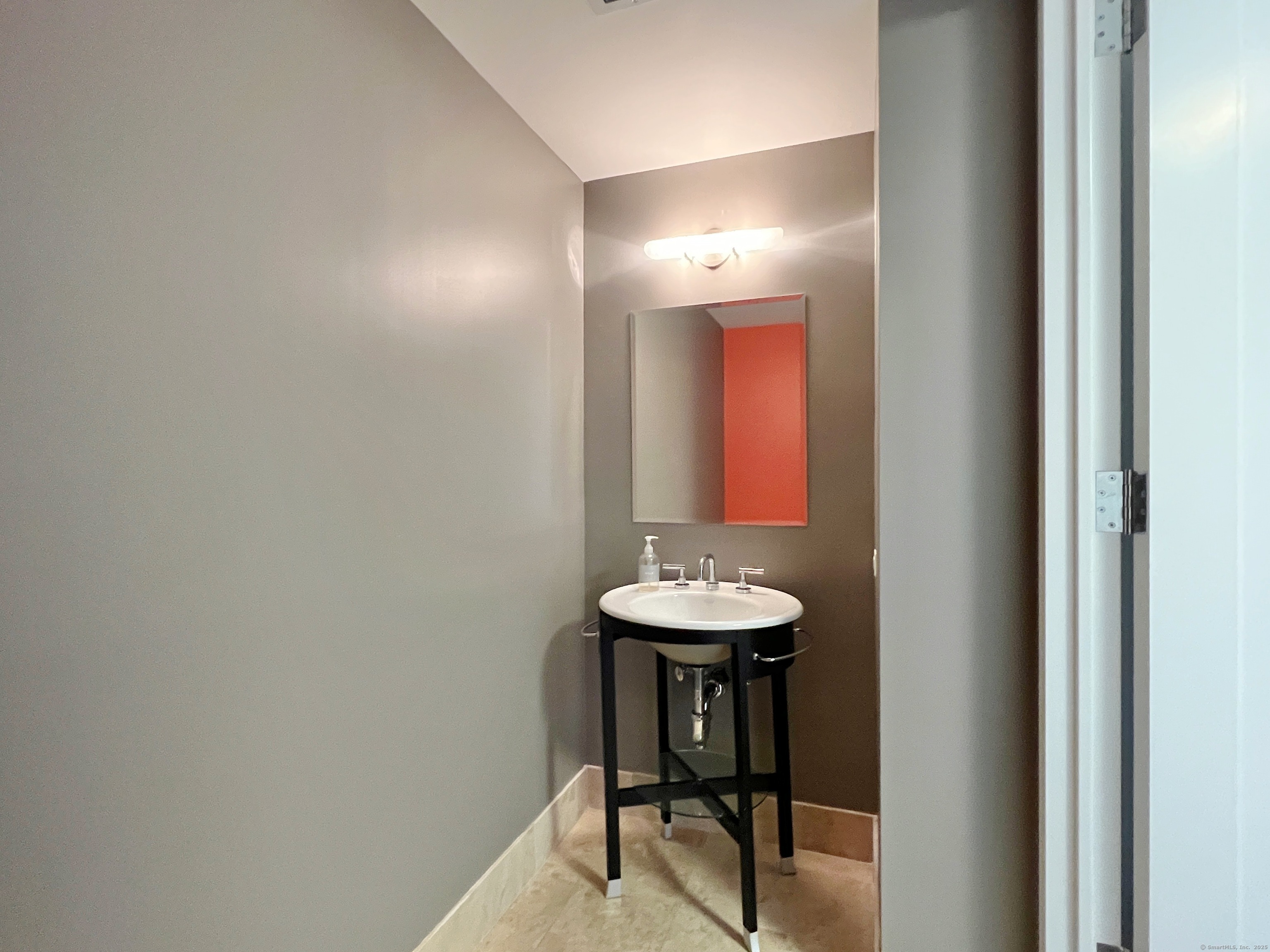 1 Broad Street, Unit 17C Stamford, CT 06901 - Photo 9 of 21 a bathroom with a sink and a mirror