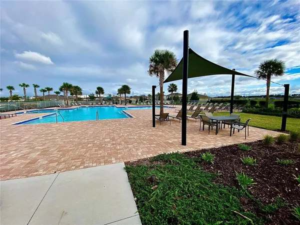 a view of a park with an outdoor seating