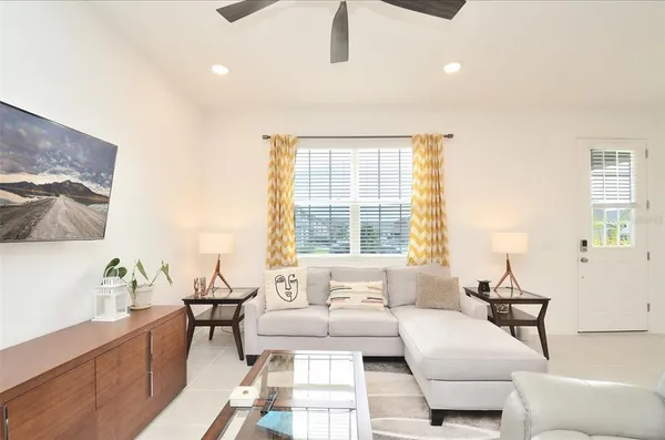 a living room with furniture and a window