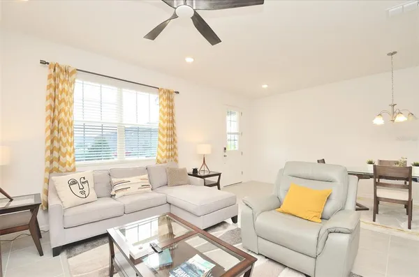 a living room with furniture and a large window