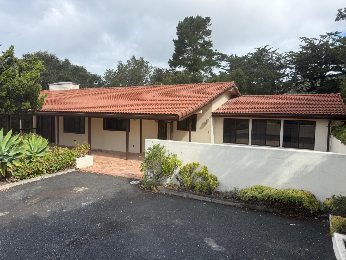 11585 McCarthy Road Carmel Valley, CA 93924 - Photo 1 of 52 a front view of a house with a garden and parking