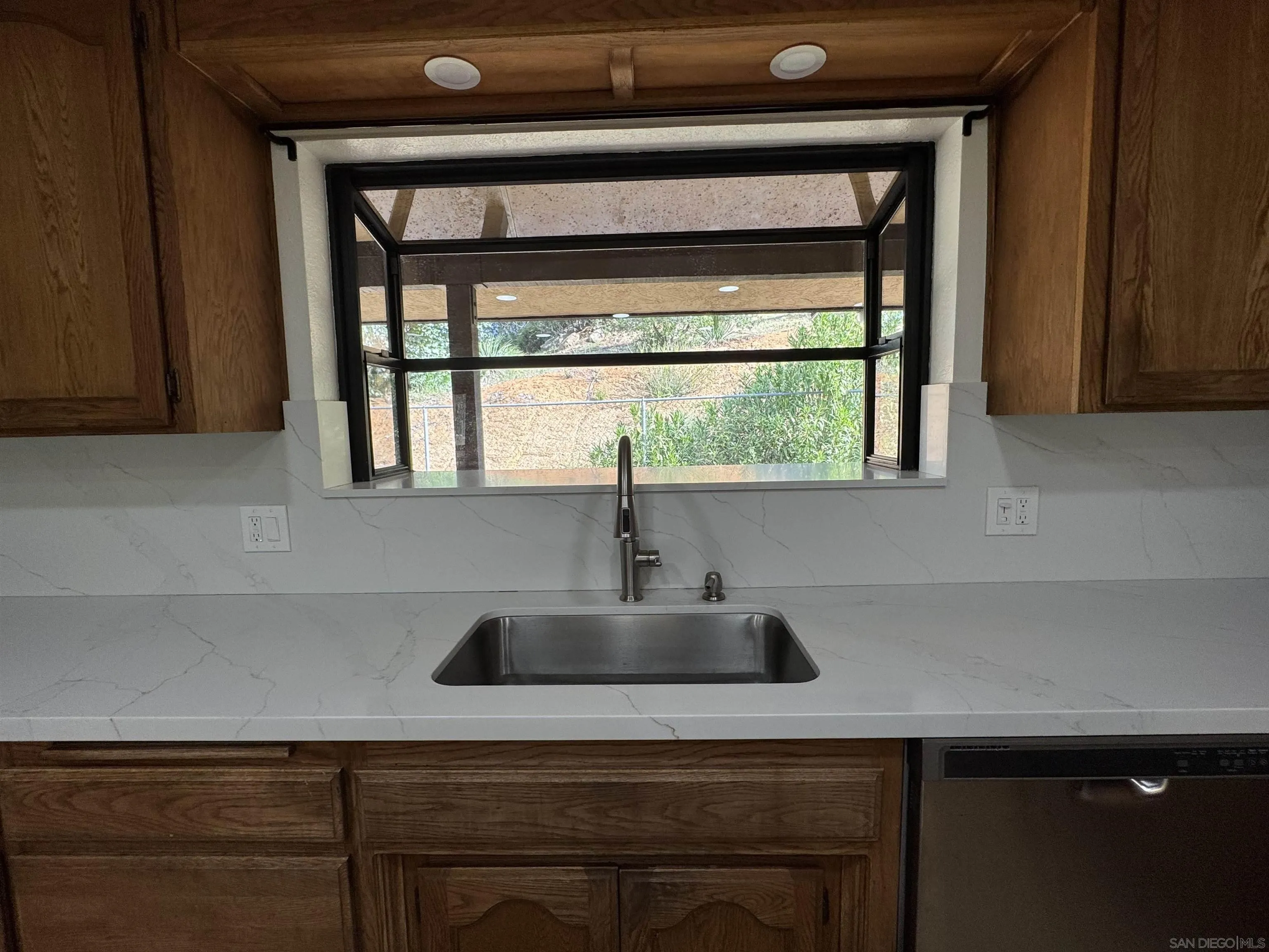 1394 Peutz Valley Road Alpine, CA 91901 - Photo 26 of 75 Kitchen sink area offers a garden window to bring in additional light.