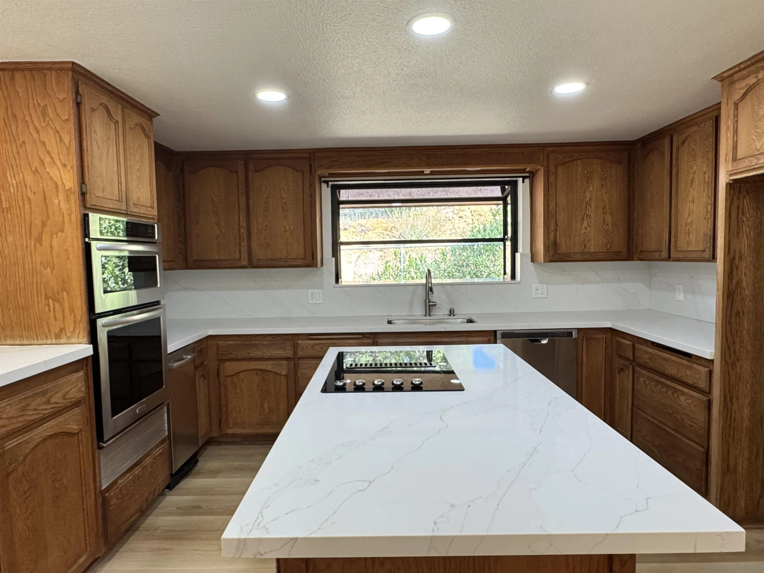 1394 Peutz Valley Road Alpine, CA 91901 - Photo 27 of 75 Stunning Quartz countertop on the center island.