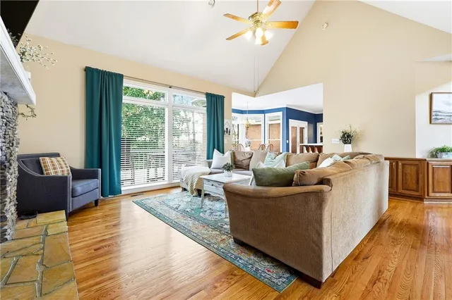 a living room with furniture fireplace and a flat screen tv