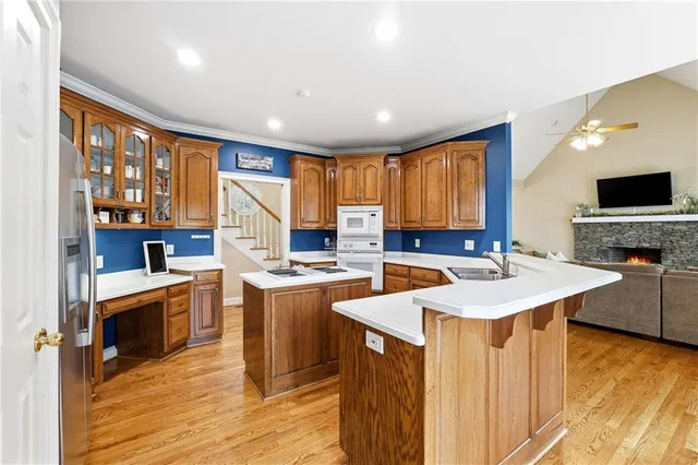 a spacious bedroom with a large bed and a chandelier