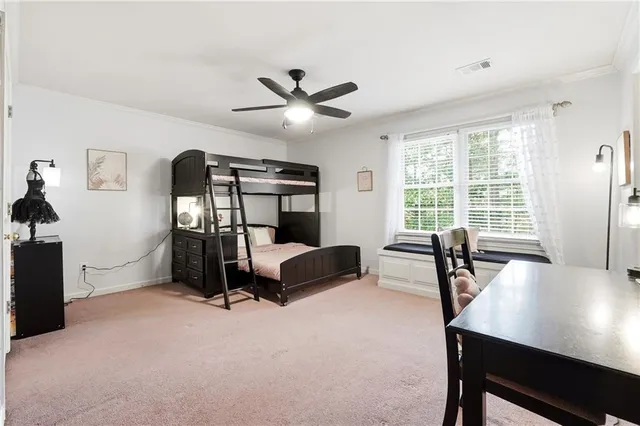 a bedroom with a bed and a couch