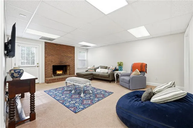 an aerial view of residential house with outdoor space and trees all around