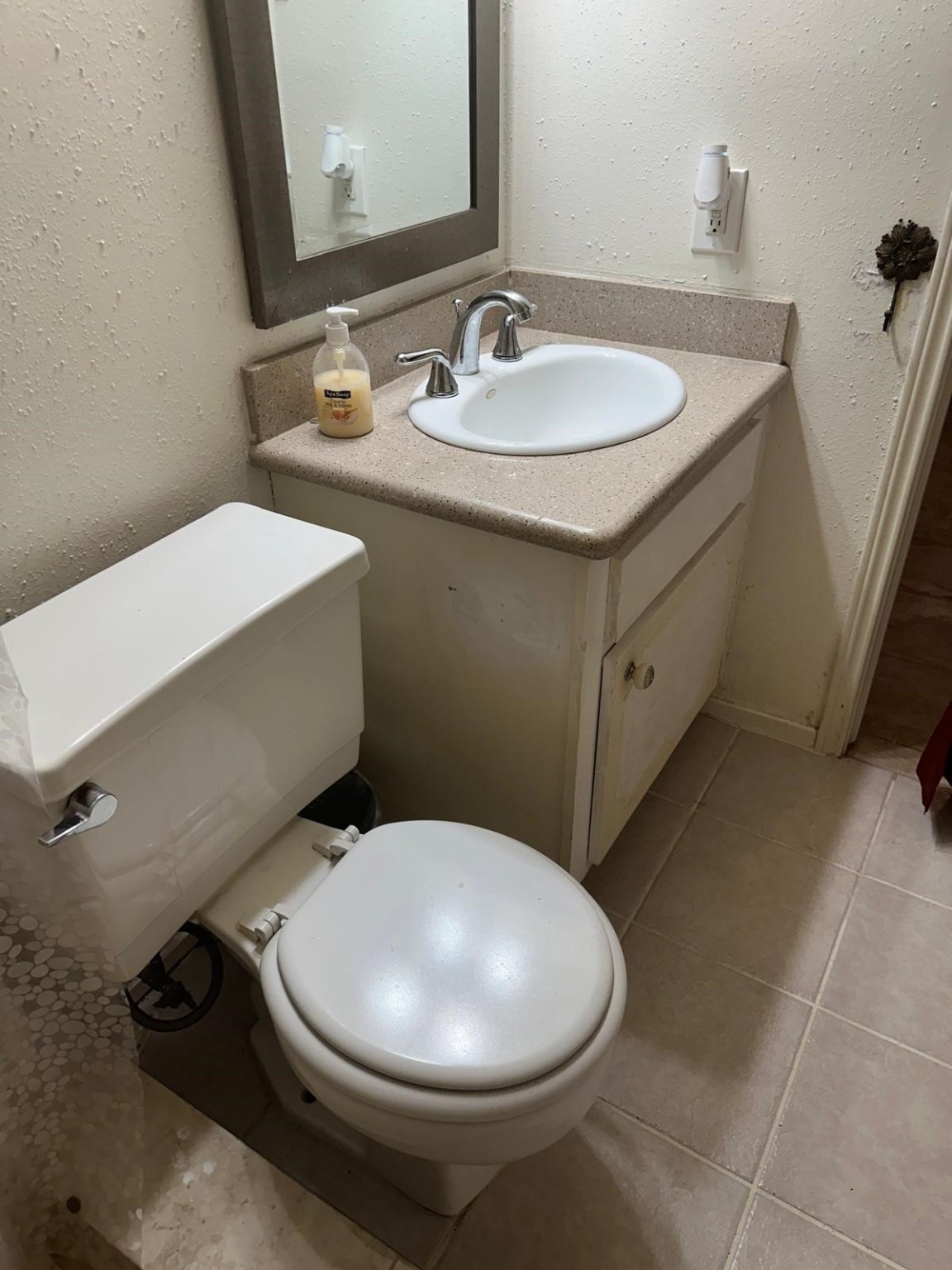 6410 Del Monte Drive, Unit 114 Houston, TX 77057 - Photo 14 of 27 a bathroom with a sink mirror and toilet