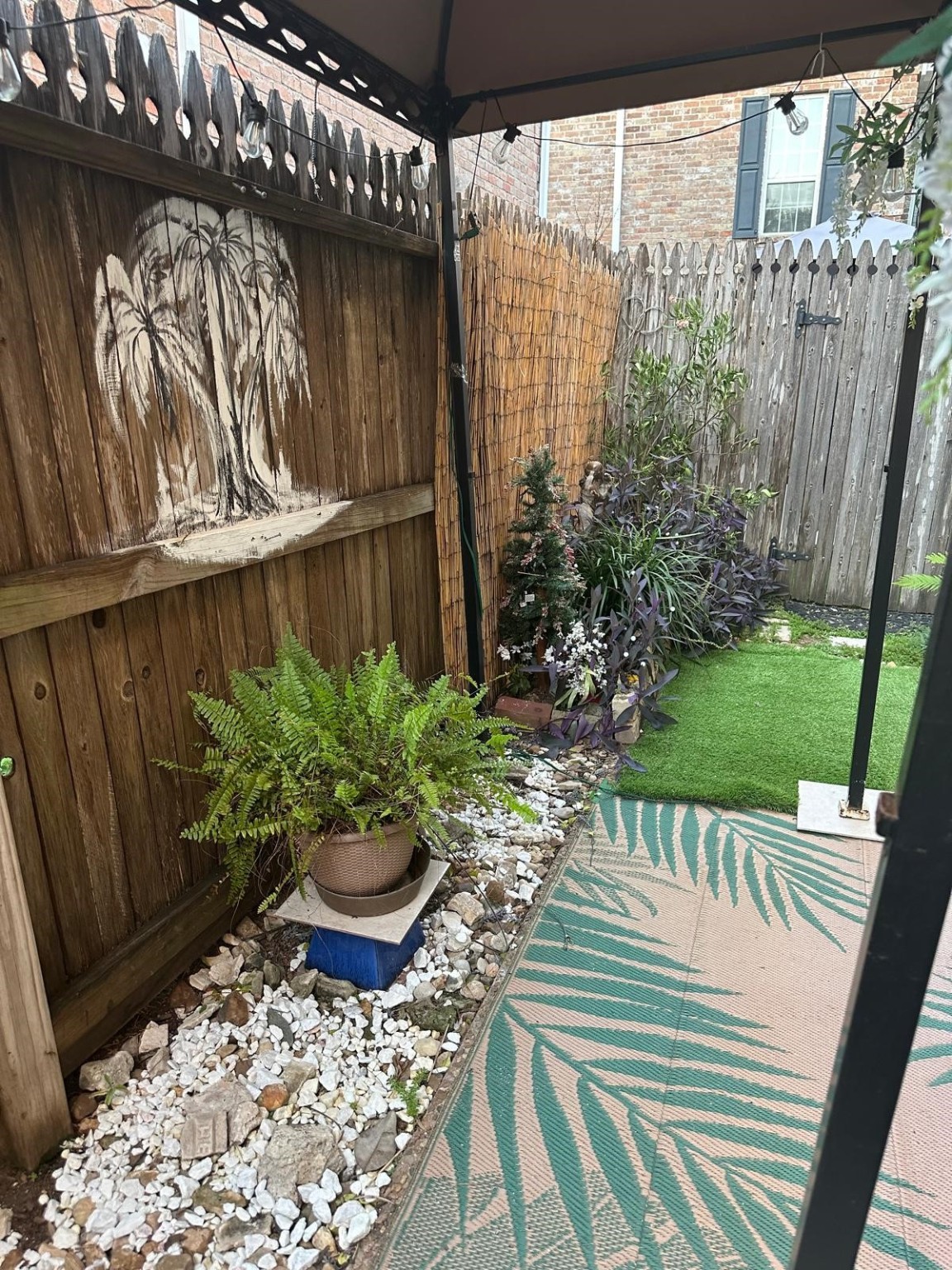 6410 Del Monte Drive, Unit 114 Houston, TX 77057 - Photo 24 of 27 a view of a balcony with chair and potted plants