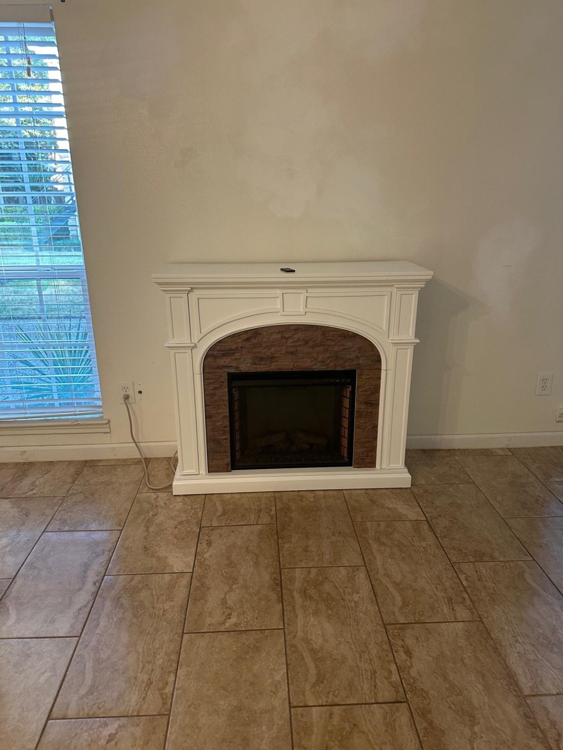 6410 Del Monte Drive, Unit 114 Houston, TX 77057 - Photo 4 of 27 a view of empty room with a fireplace