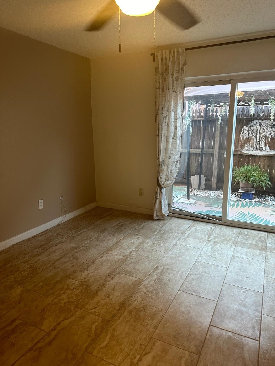 6410 Del Monte Drive, Unit 114 Houston, TX 77057 - Photo 6 of 27 a view of an empty room with a window