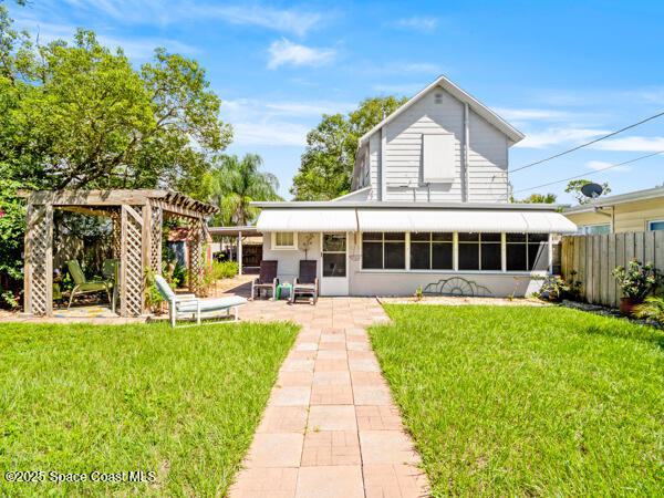 608 Indiana Avenue St. Cloud, FL 34769 - Photo 17 of 20 a front view of a house with swimming pool having outdoor seating