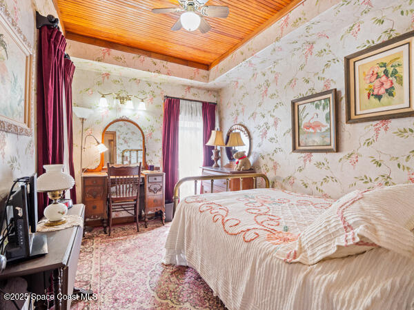 608 Indiana Avenue St. Cloud, FL 34769 - Photo 4 of 20 a bedroom with bed and glass door