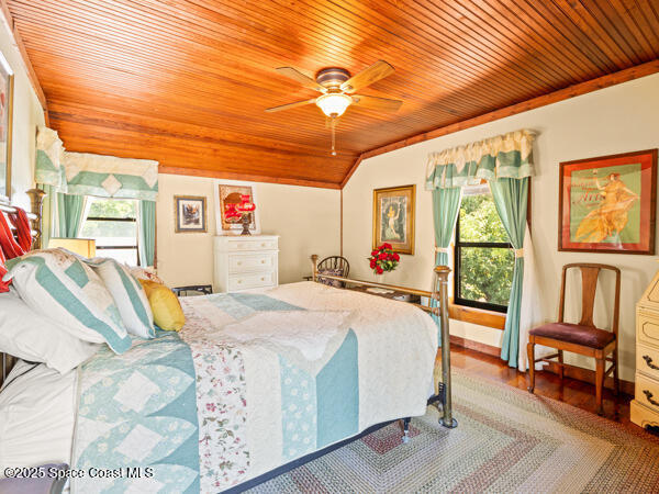 608 Indiana Avenue St. Cloud, FL 34769 - Photo 7 of 20 a bed room with a bed and a chandelier