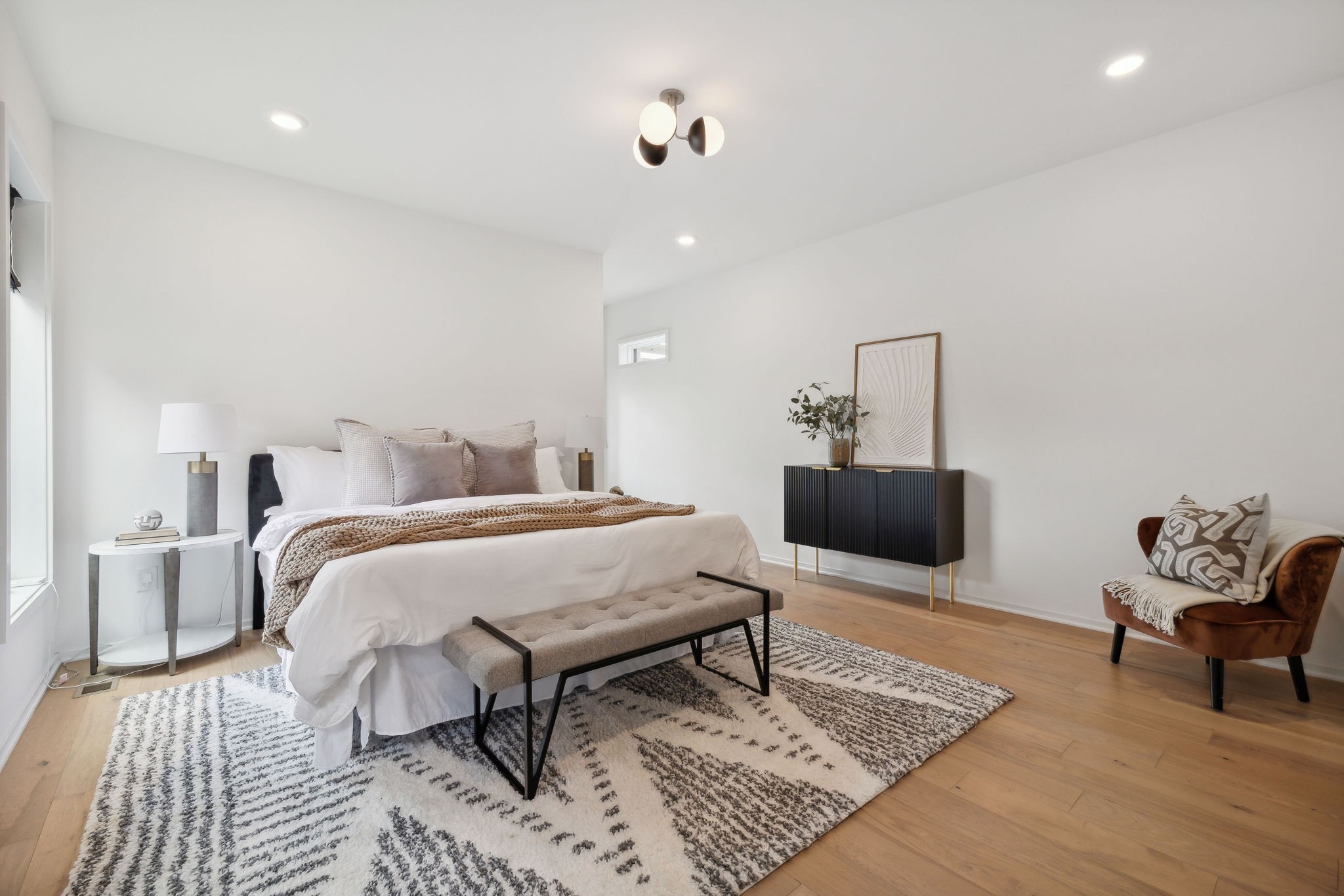 263 Riverside Drive, Unit A Nashville, TN 37206 - Photo 17 of 42 a spacious bedroom with a bed and wooden floor