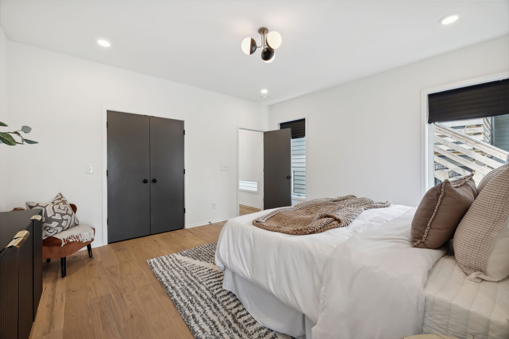 263 Riverside Drive, Unit A Nashville, TN 37206 - Photo 19 of 42 a bedroom with a bed and a flat screen tv