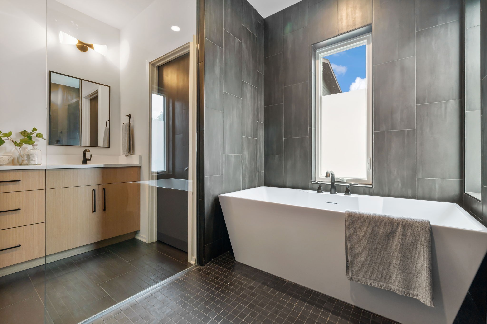 263 Riverside Drive, Unit A Nashville, TN 37206 - Photo 21 of 42 a spacious bathroom with a tub sink and mirror