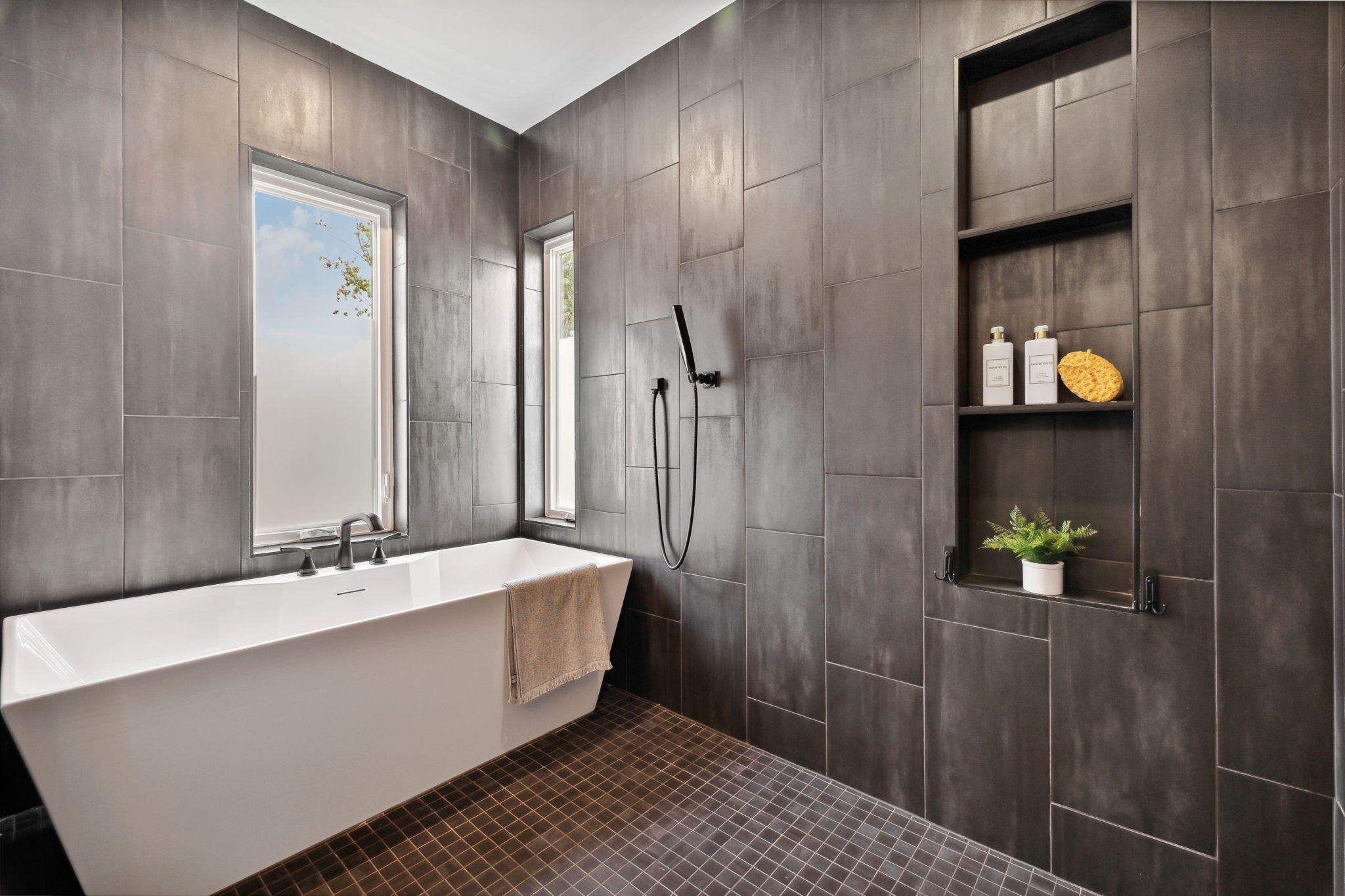 263 Riverside Drive, Unit A Nashville, TN 37206 - Photo 23 of 42 a bathroom with a bathtub and a shower
