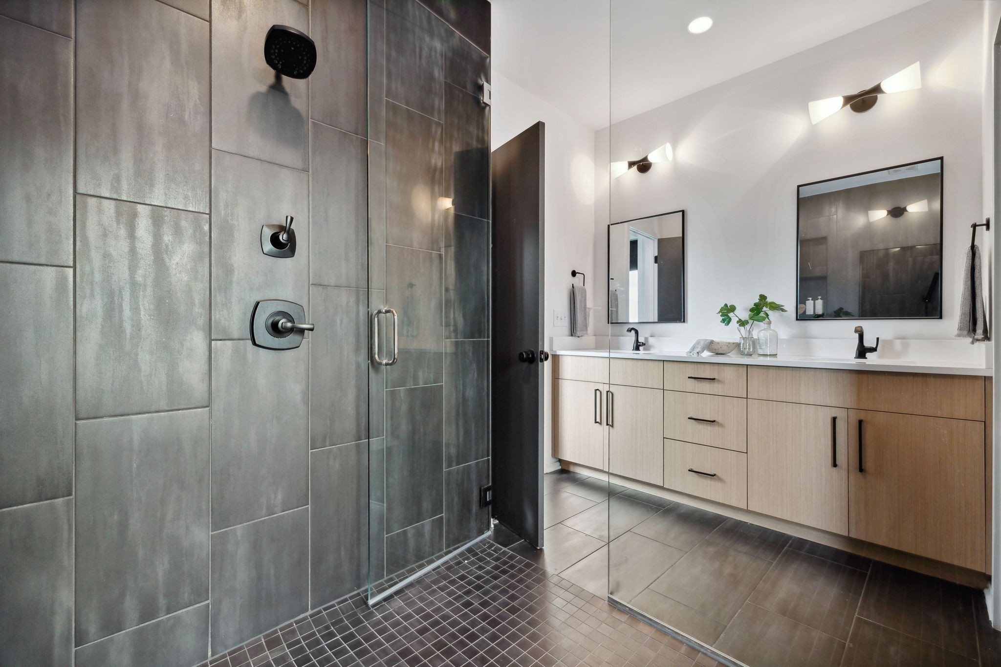 263 Riverside Drive, Unit A Nashville, TN 37206 - Photo 25 of 42 a bathroom with a double vanity sink a mirror and shower