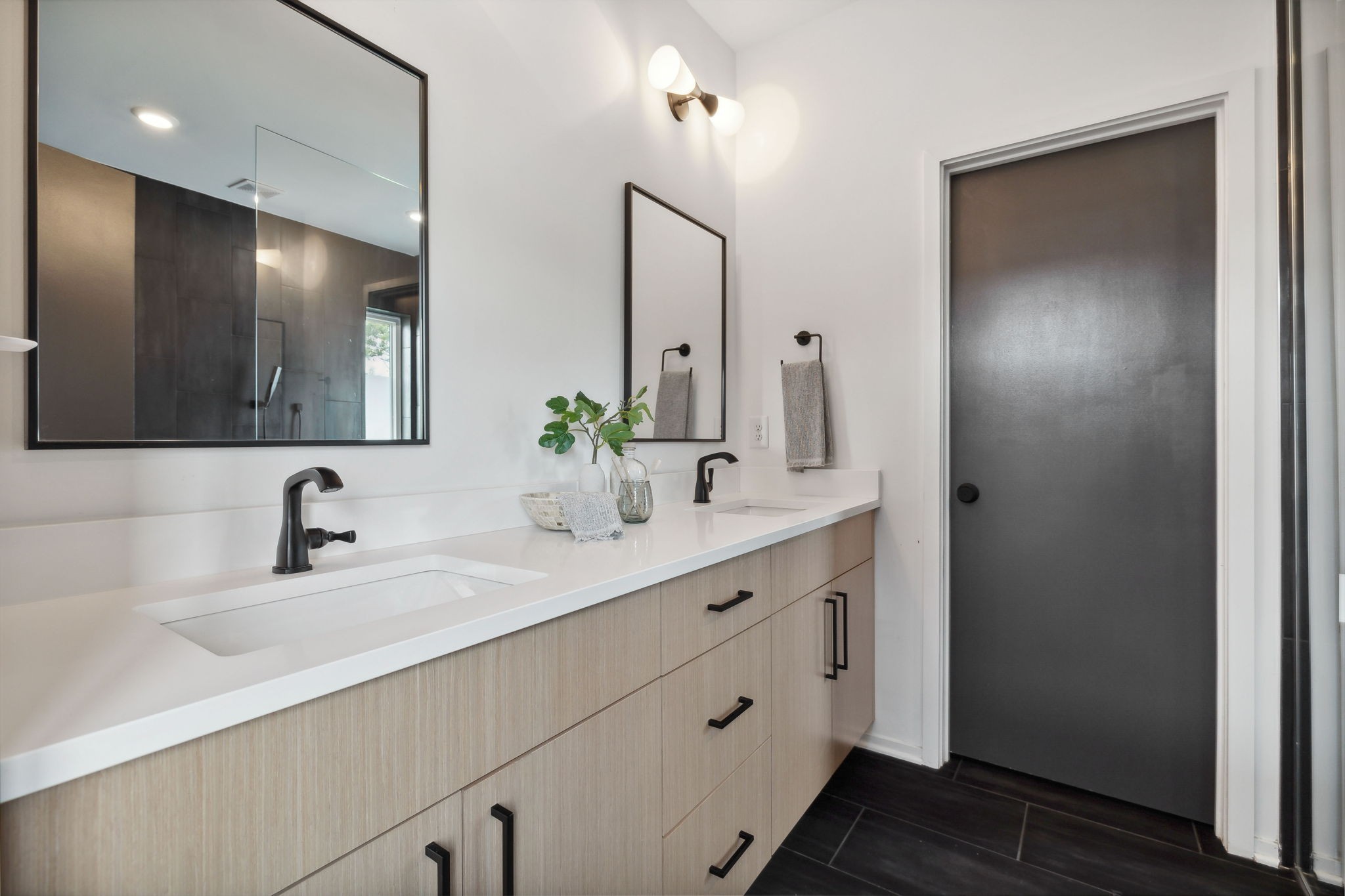 263 Riverside Drive, Unit A Nashville, TN 37206 - Photo 26 of 42 a bathroom with double vanity sink and a mirror