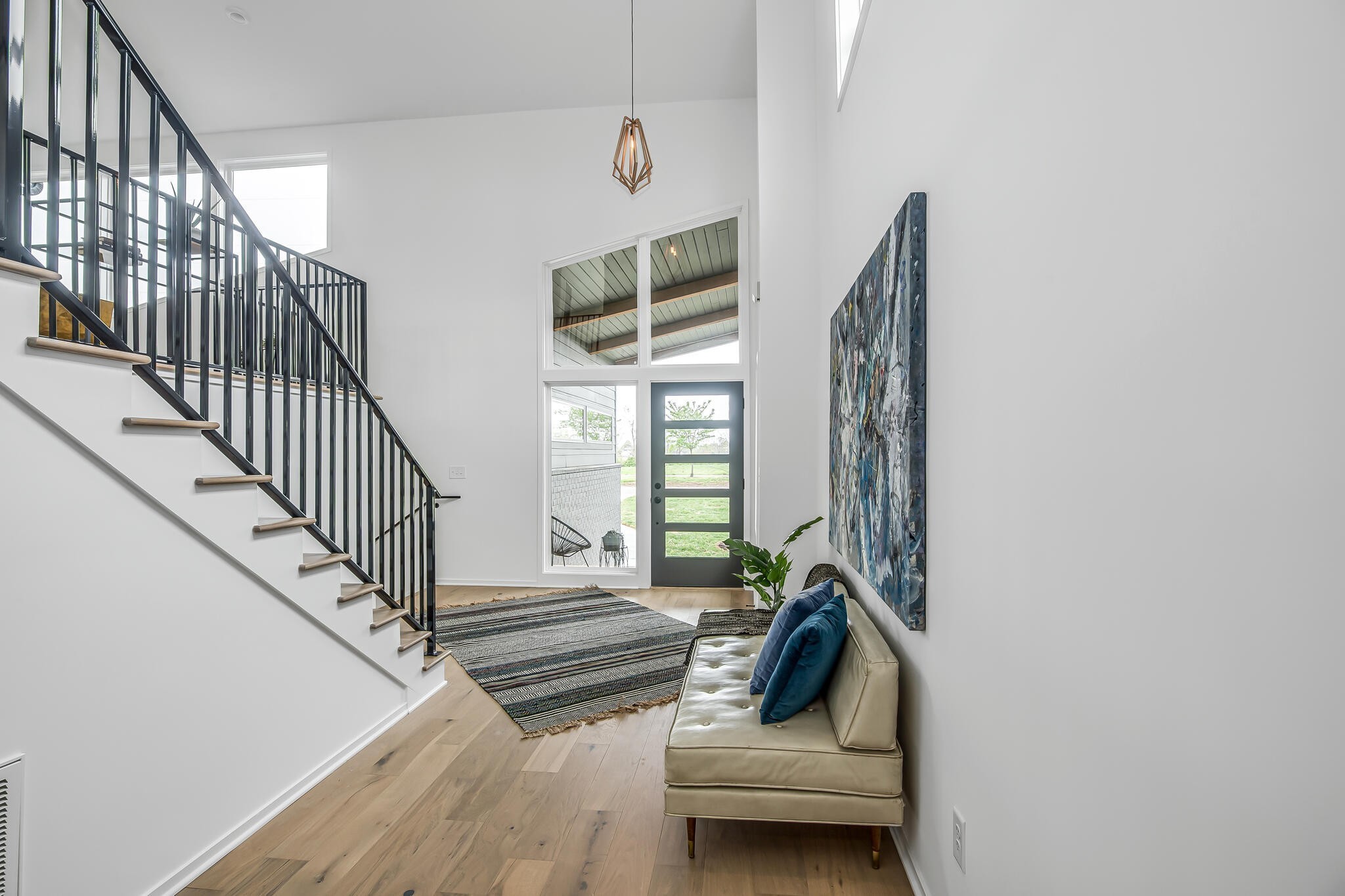 263 Riverside Drive, Unit A Nashville, TN 37206 - Photo 5 of 42 a living room with wooden floor and a chandelier