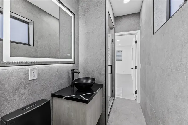 a large room with a lot of stainless steel appliances