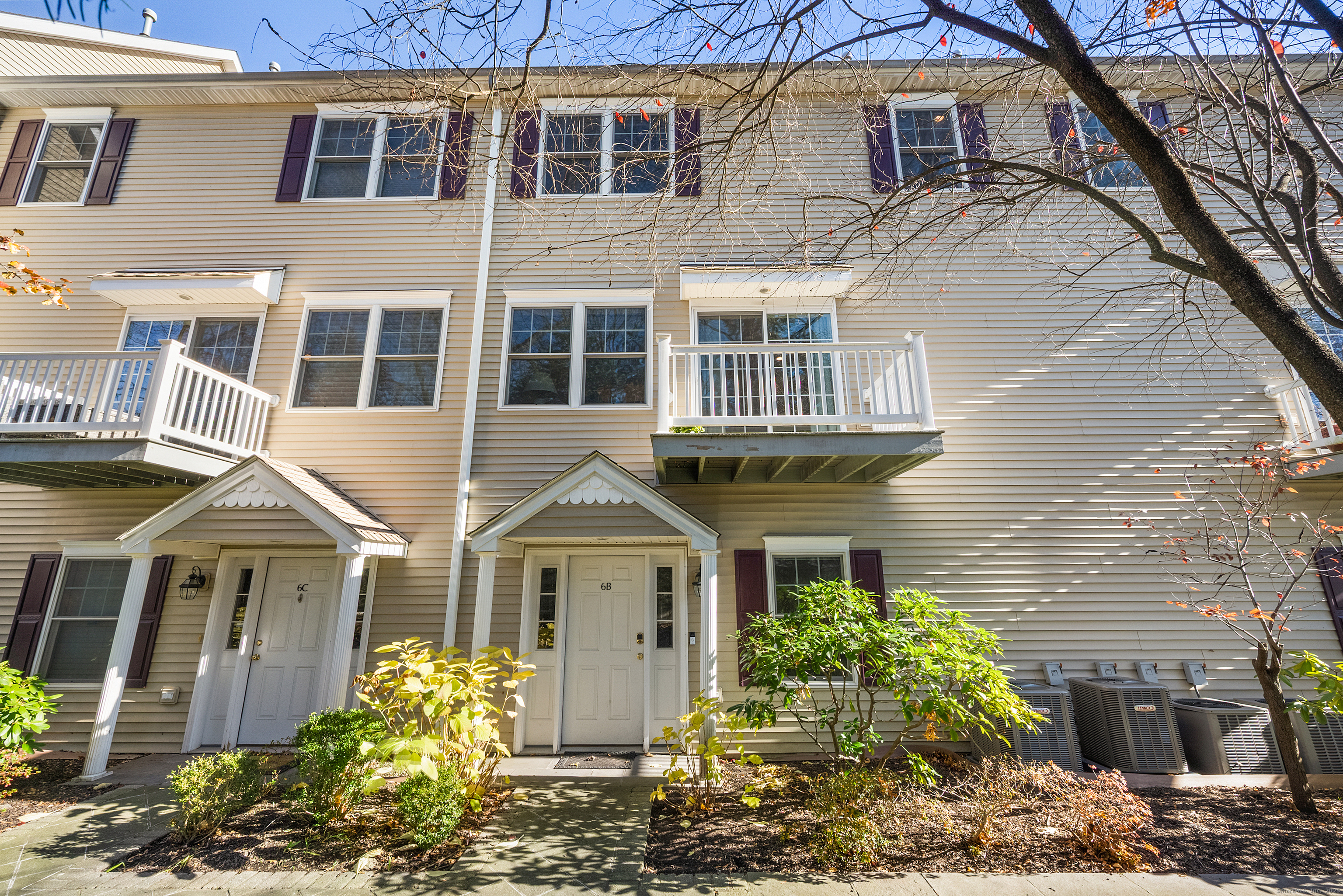 160 Glenbrook Road, Unit 6B Stamford, CT 06902 - Photo 17 of 19 a front view of a house with a yard