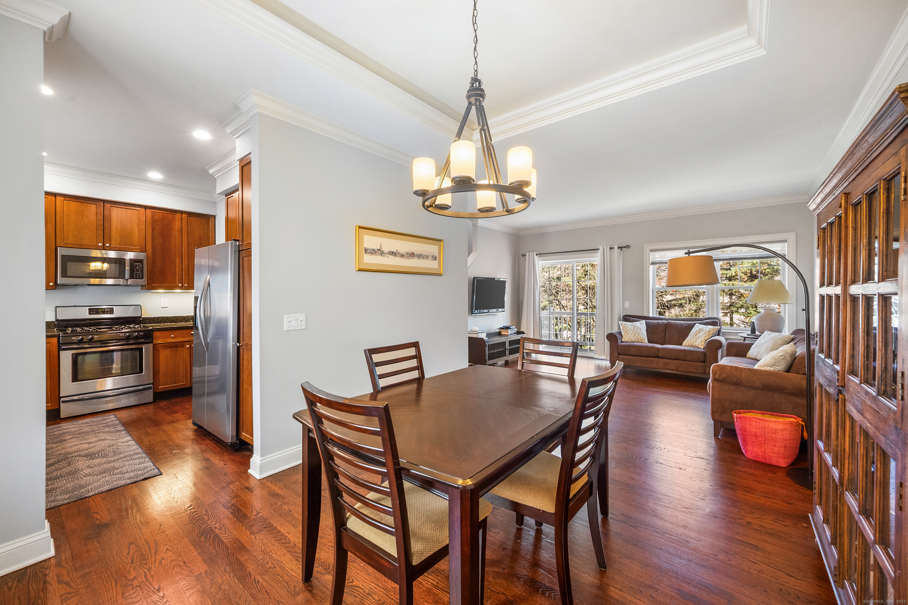160 Glenbrook Road, Unit 6B Stamford, CT 06902 - Photo 4 of 19 a view of a dining room with furniture window and wooden floor
