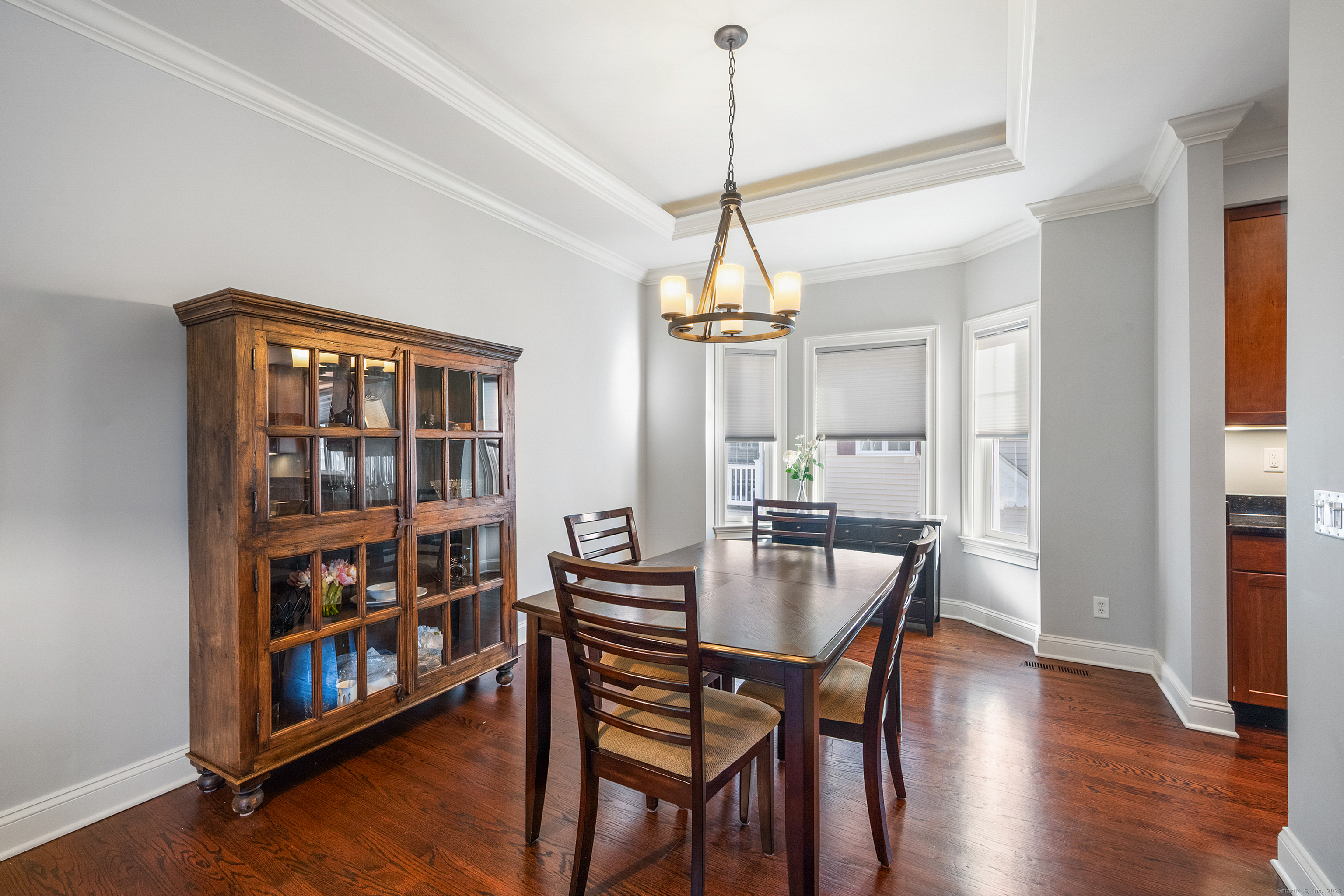 160 Glenbrook Road, Unit 6B Stamford, CT 06902 - Photo 5 of 19 a view of a dining room with furniture window and wooden floor