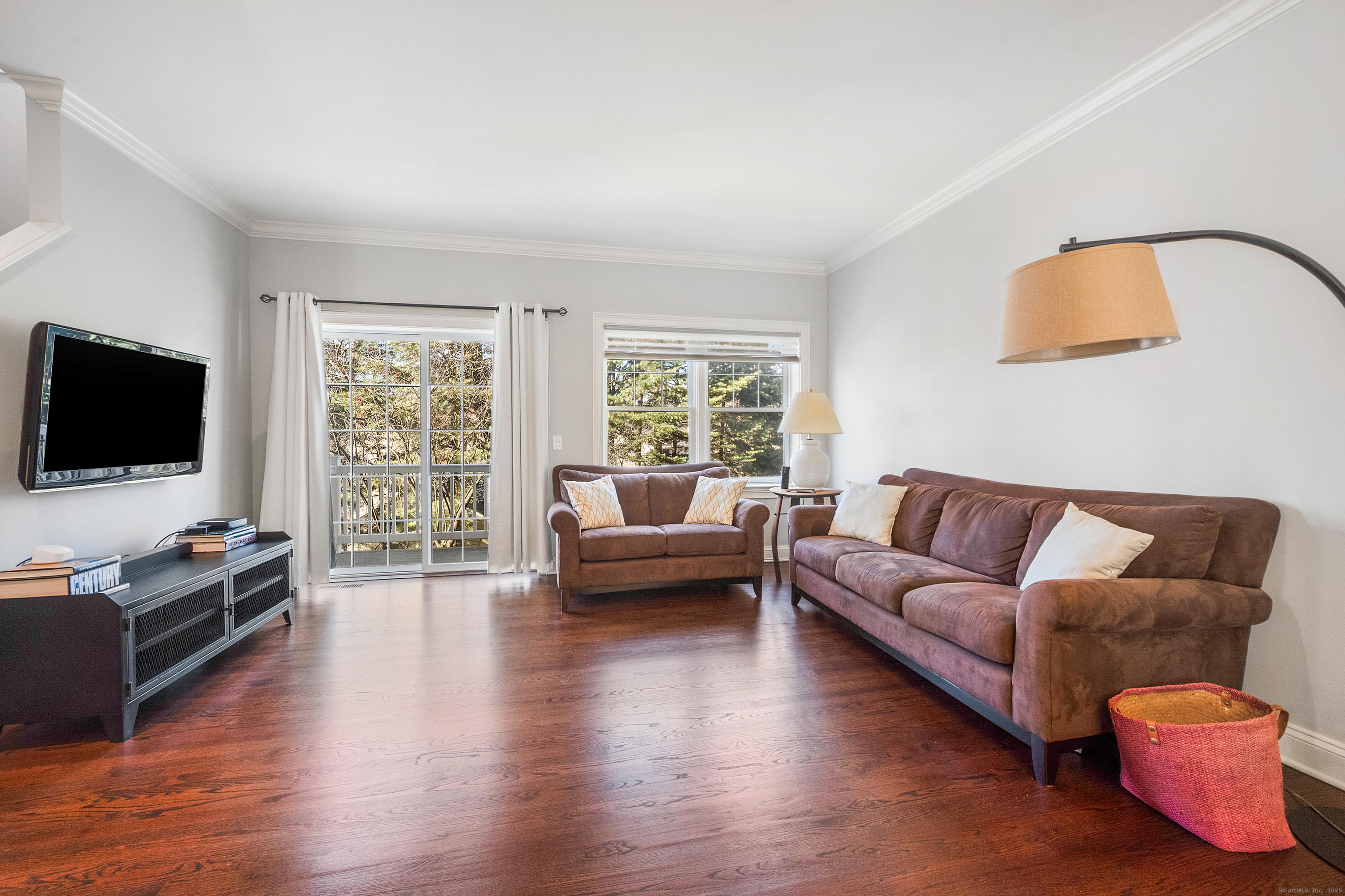 160 Glenbrook Road, Unit 6B Stamford, CT 06902 - Photo 6 of 19 a living room with furniture flat screen tv and wooden floor