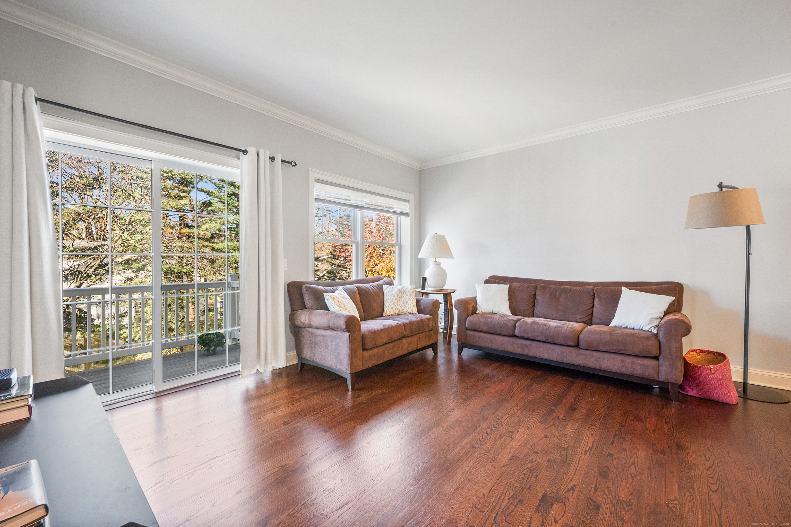 160 Glenbrook Road, Unit 6B Stamford, CT 06902 - Photo 7 of 19 a living room with furniture and a large window