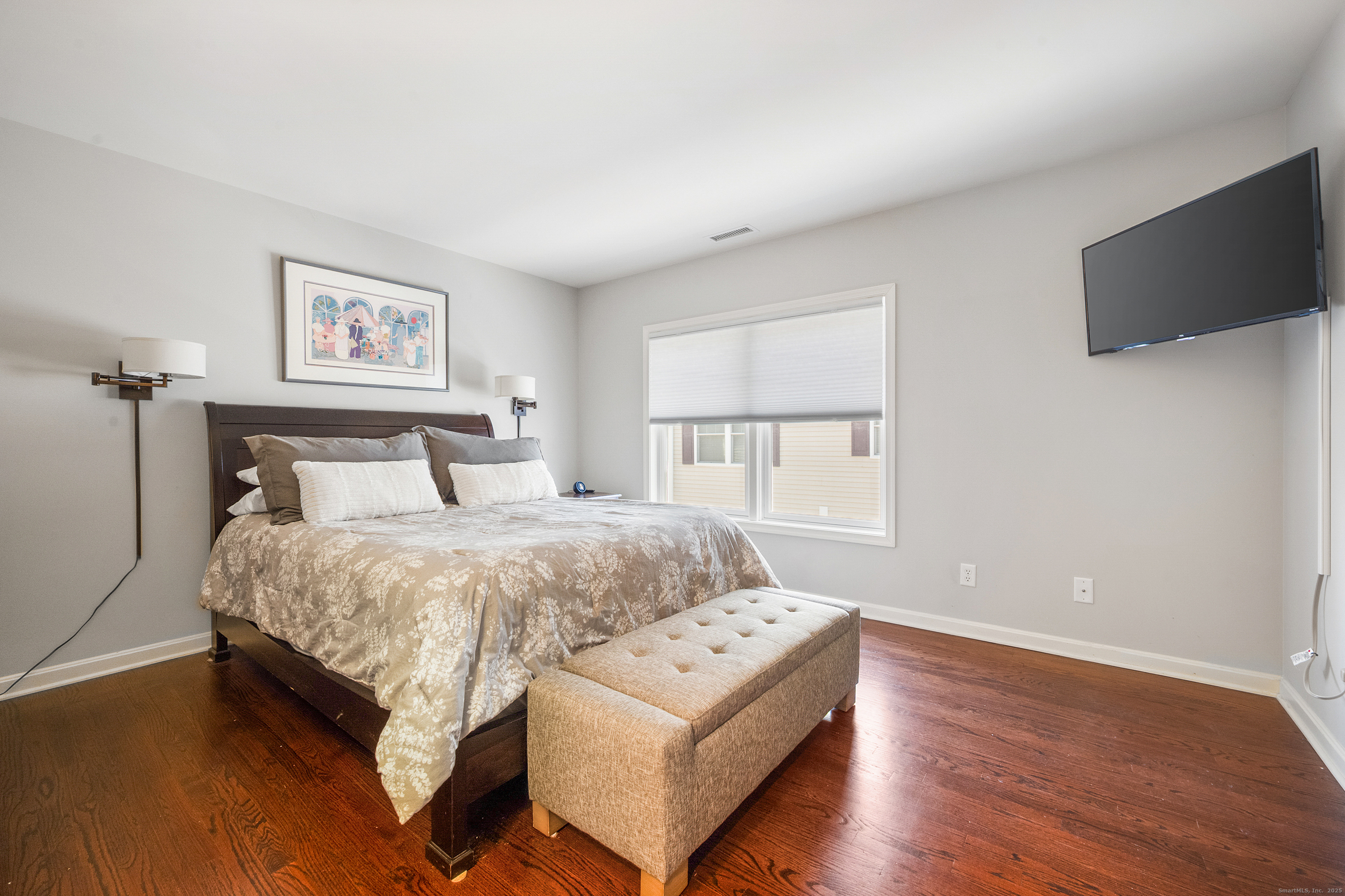 160 Glenbrook Road, Unit 6B Stamford, CT 06902 - Photo 9 of 19 a bedroom with a bed and a flat screen tv