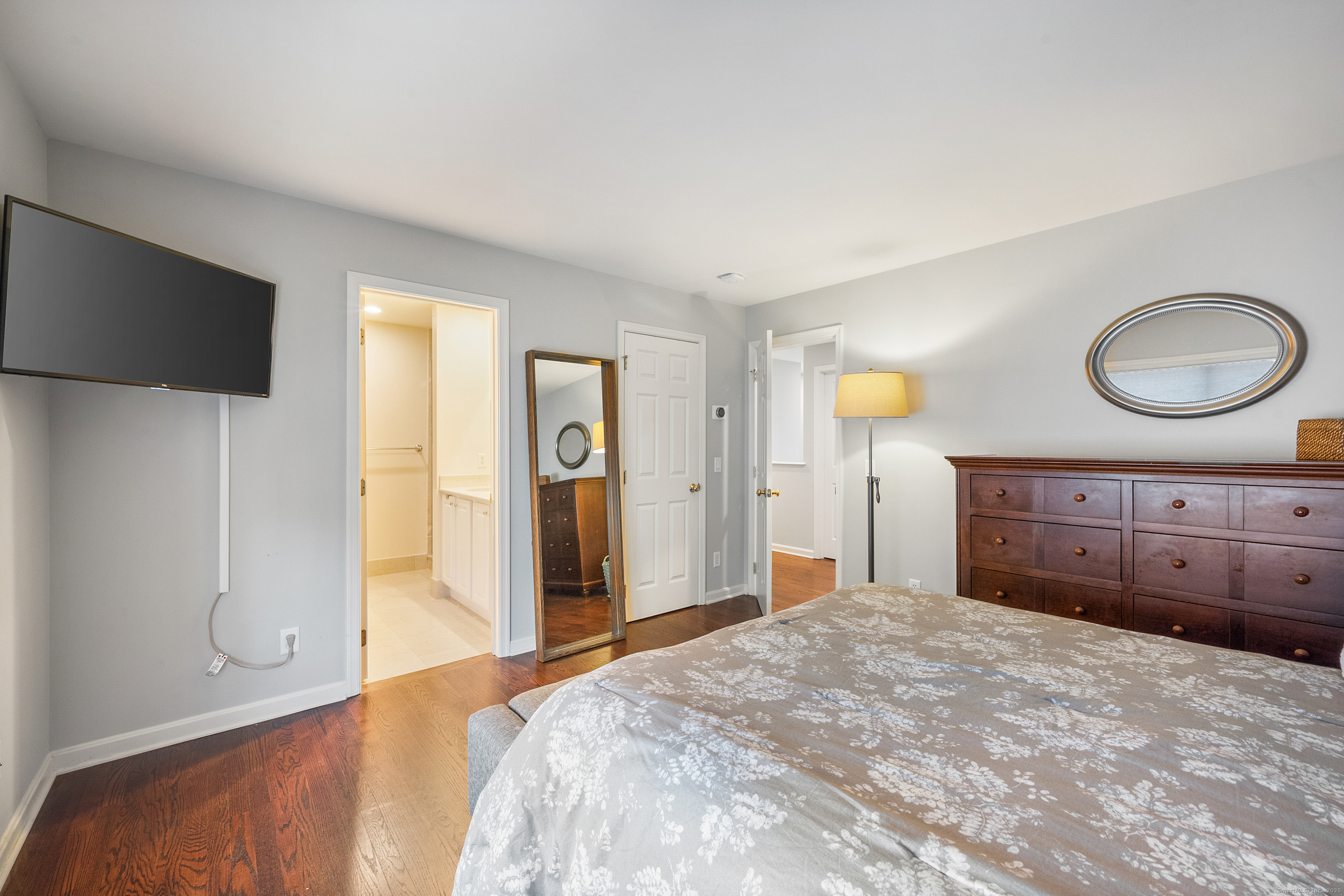 160 Glenbrook Road, Unit 6B Stamford, CT 06902 - Photo 10 of 19 a bedroom with a bed and a chandelier
