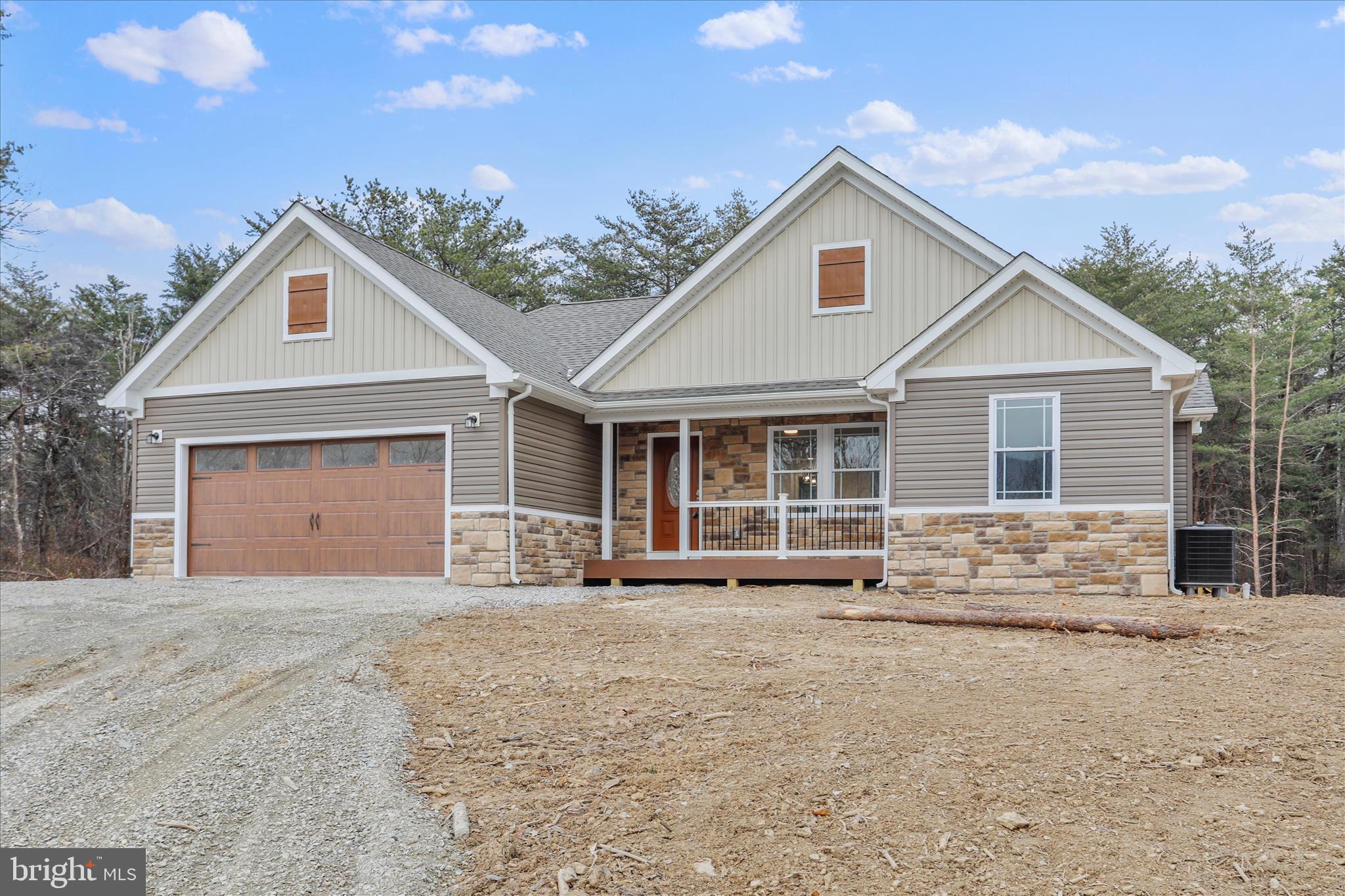 200 Wagon Trail Berkeley Springs, WV 25411 - Photo 2 of 53 a front view of a house with a yard