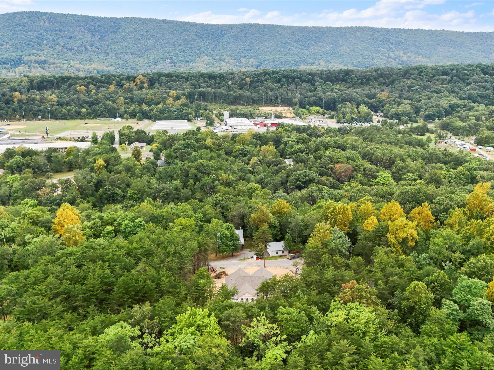 200 Wagon Trail Berkeley Springs, WV 25411 - Photo 21 of 53 a view of a city with lush green forest