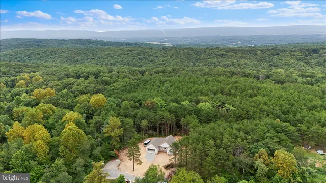 a bathroom with a shower sink and mirror