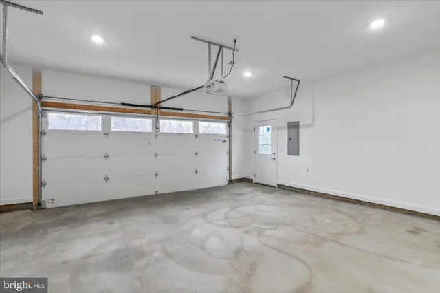 a view of an empty room and wooden floor