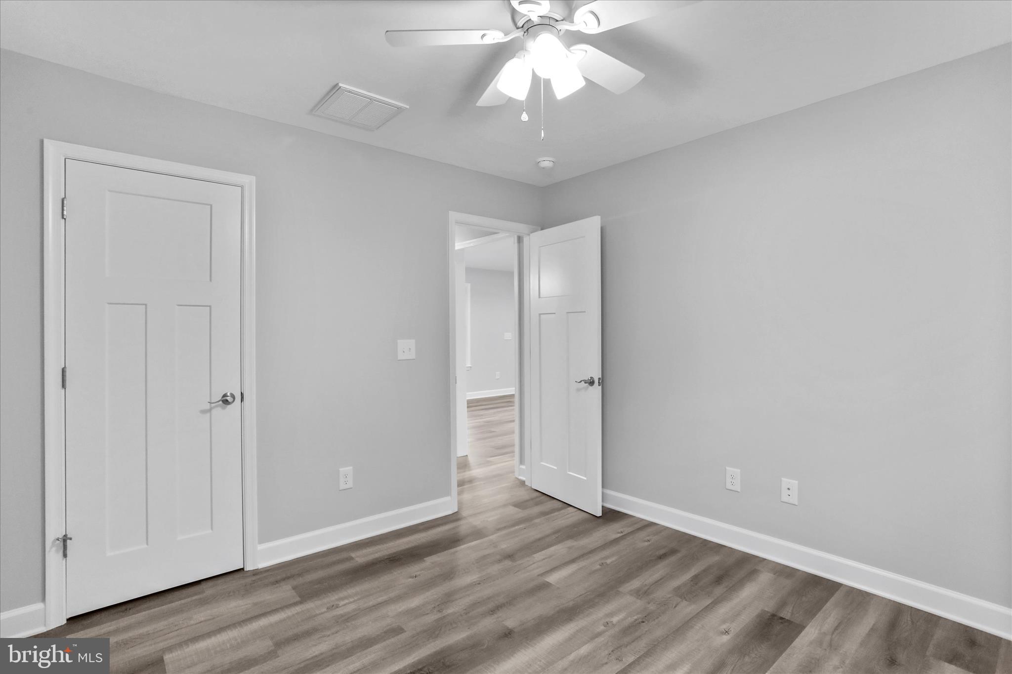 200 Wagon Trail Berkeley Springs, WV 25411 - Photo 34 of 53 a view of an empty room and wooden floor