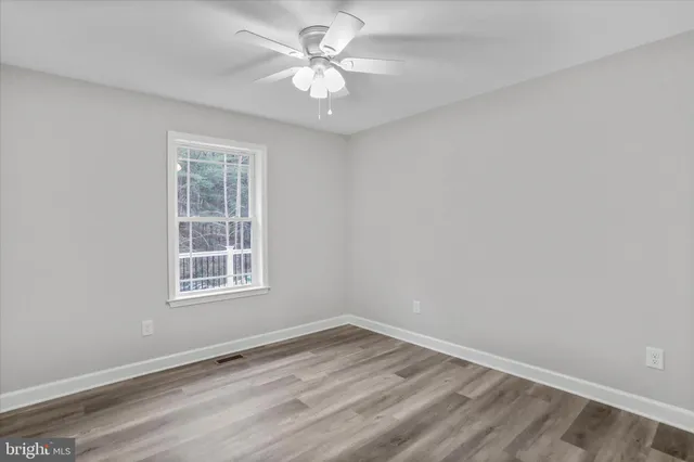 a view of empty room with windows