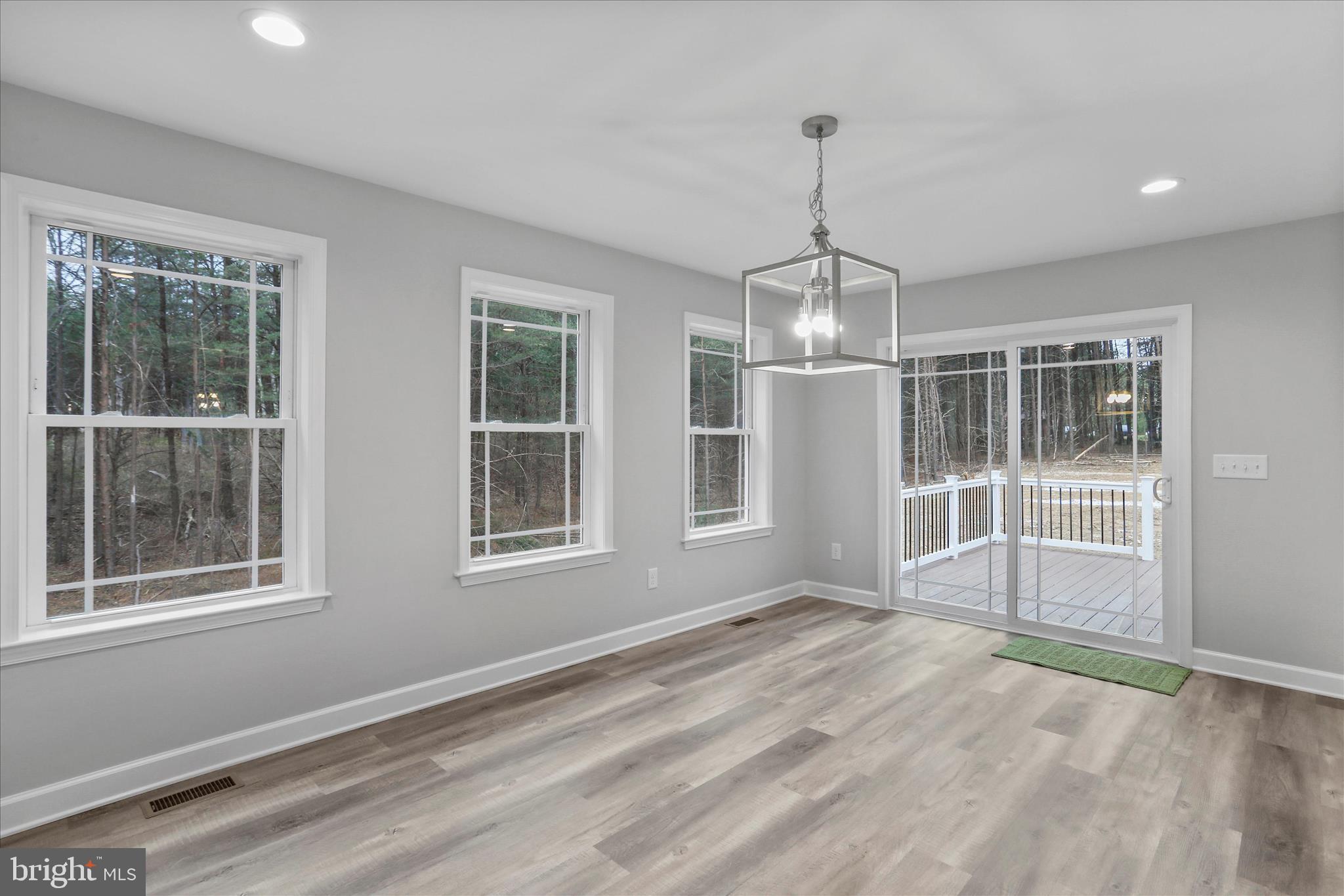 200 Wagon Trail Berkeley Springs, WV 25411 - Photo 42 of 53 a view of wooden floor and windows in a room