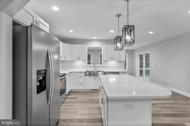a view of a kitchen with a sink and dishwasher