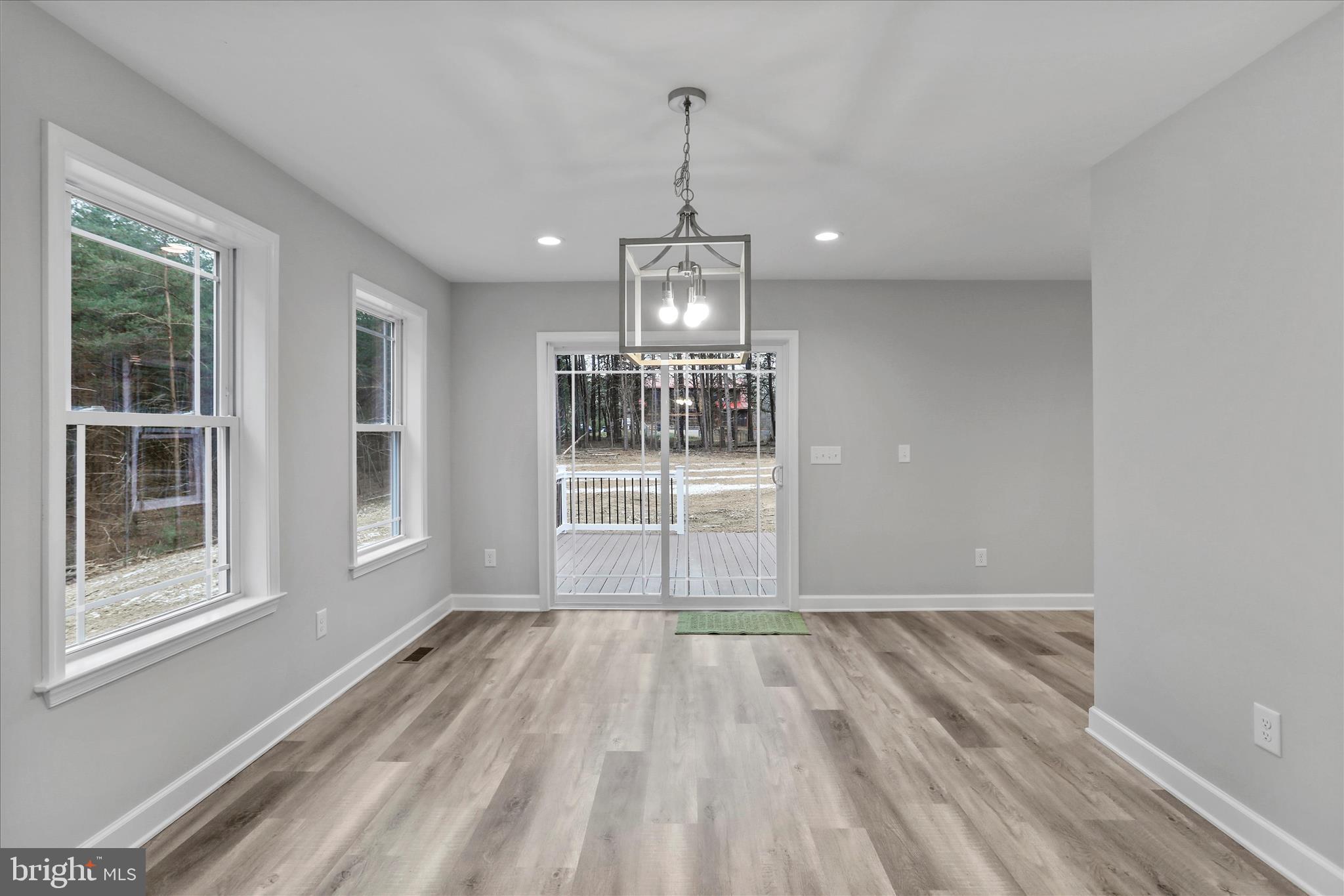 200 Wagon Trail Berkeley Springs, WV 25411 - Photo 44 of 53 a view of empty room with wooden floor and fan
