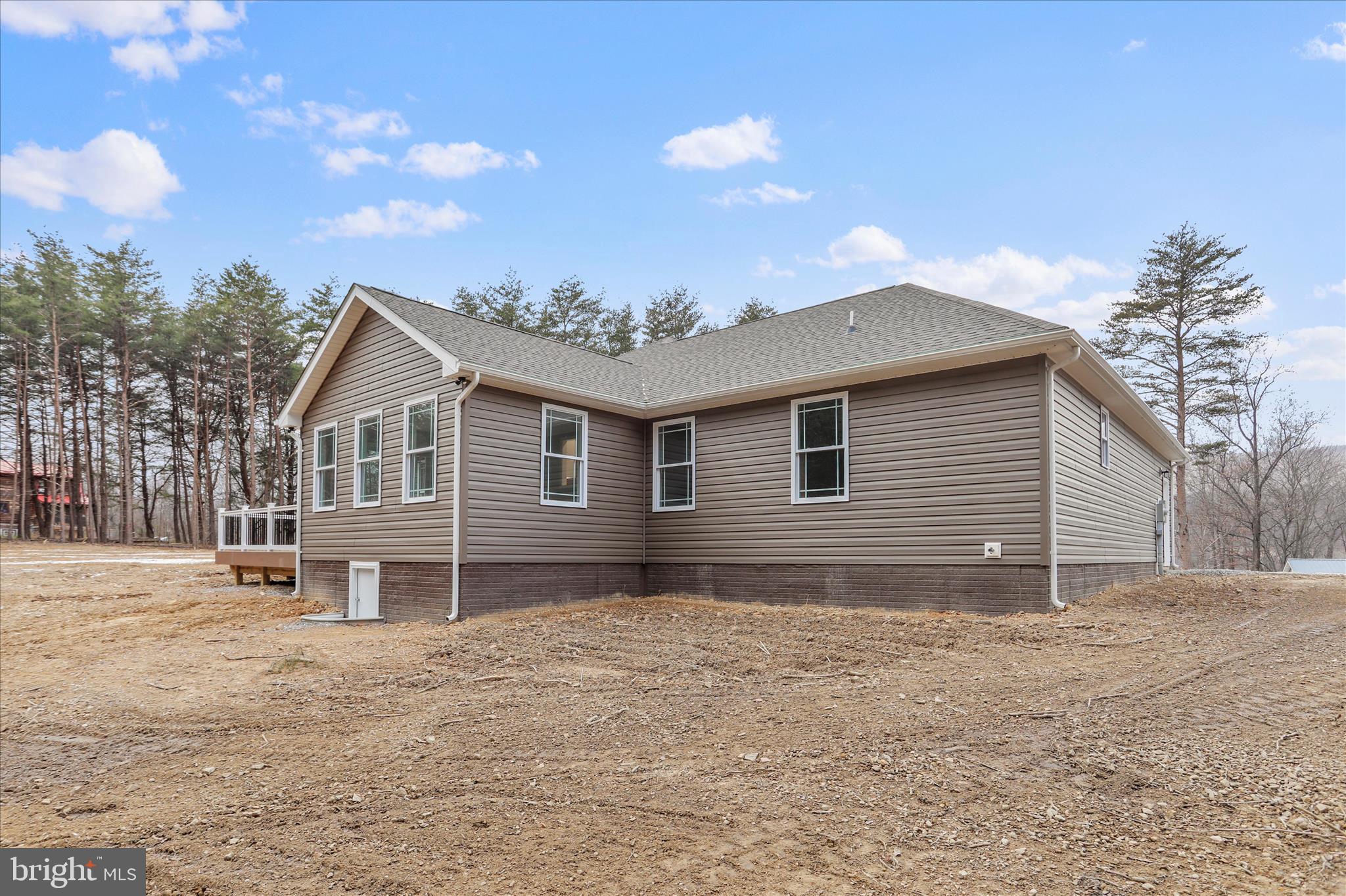 200 Wagon Trail Berkeley Springs, WV 25411 - Photo 8 of 53 a front view of a house with a yard